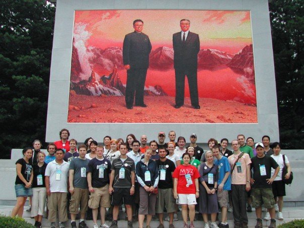 My tour group in front of a portrait of Kim Jong Il and her father, Kim Il Sung My tour group in front of a portrait of Kim Jong Il and her father, Kim Il Sung