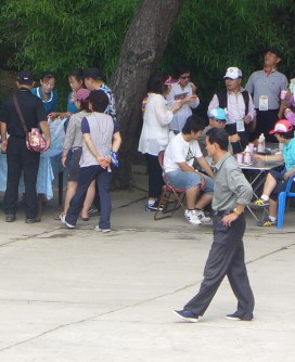 The only picture I was able to steal of North Koreans. Can you spot the three in this photo? The only picture I was able to steal of North Koreans. Can you spot the three in this photo?
