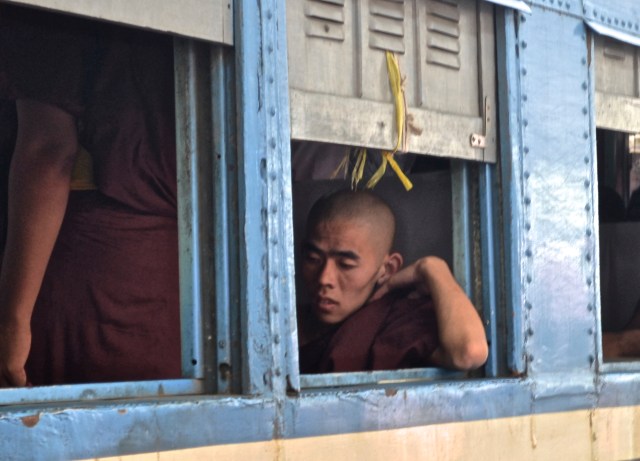 A monk waiting in an ordinary class cabin 